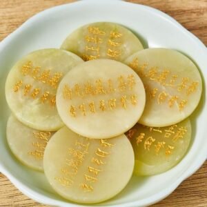 Front view of Sacred Green Jade Disc with golden engraved mantra