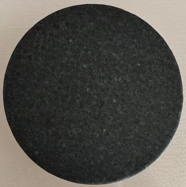 Single round deep black jade stone with fine speckled texture