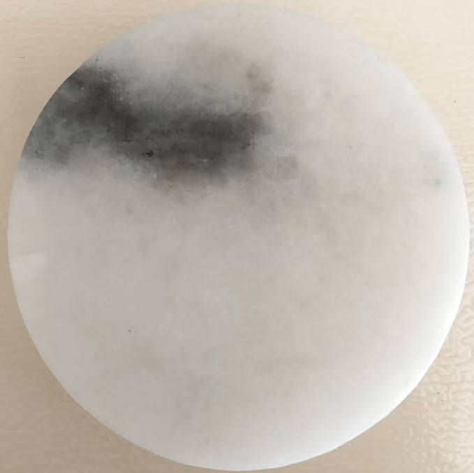 Single round white jade stone with natural dark gray vein pattern